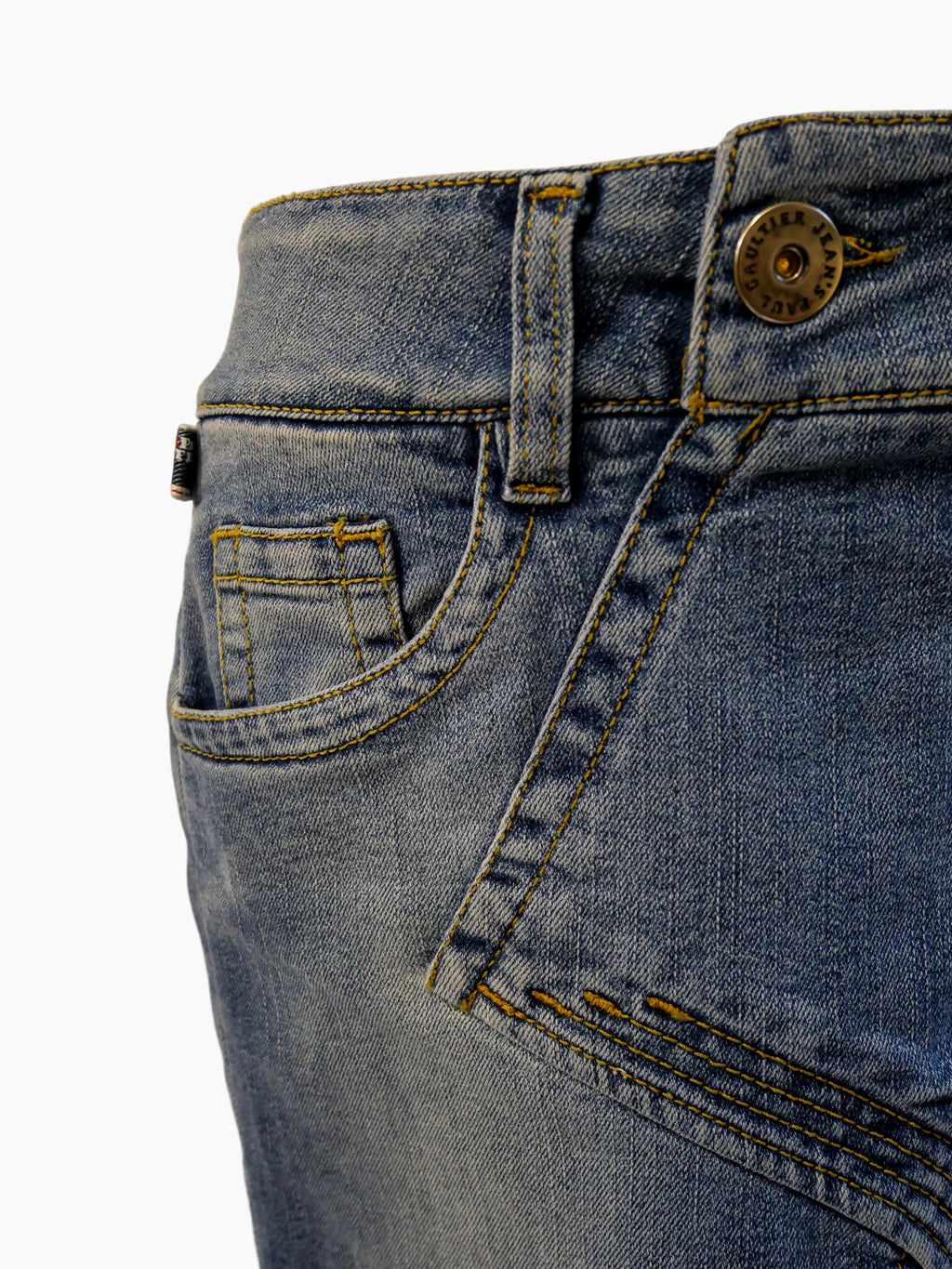 Close-up of blue jeans on a mannequin with a white background